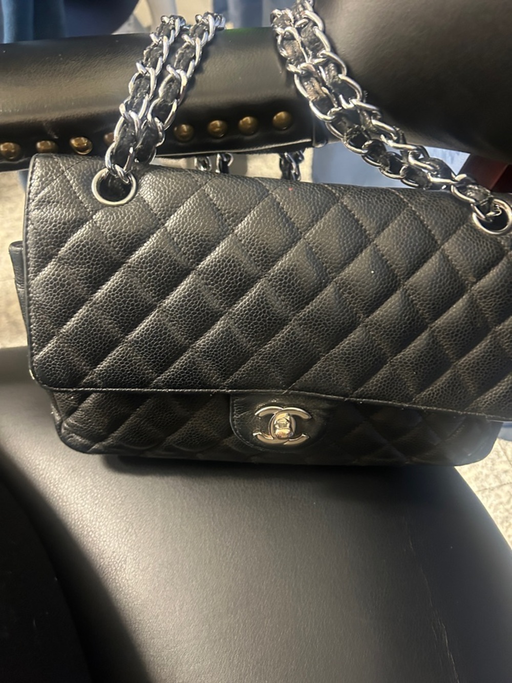 CHANEL Black Quilted Shoulder Bag with Silver Chain and CC Turn-Lock caviar